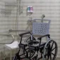Bathmobile-Commode-Shower-Chair-in-Bathroom.webp