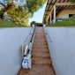Folded-Bespoke-Synergy-Straight-Stairlift-Outside-Home.jpg