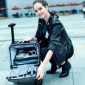 Person-Opening-Airwheel-Luggage-SE3-Mini-T.jpeg