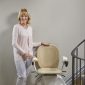 Woman-Standing-NEar-Bespoke-Synergy-Straight-Stairlift.jpg