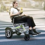 People Using Smart App Controlling and Folding Electric Wheelchair